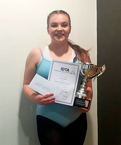 Dancer with winning trophy